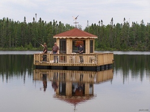 A floating gazebo built with dock floats and electric boat motors